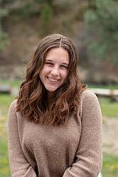 young woman in front of green background